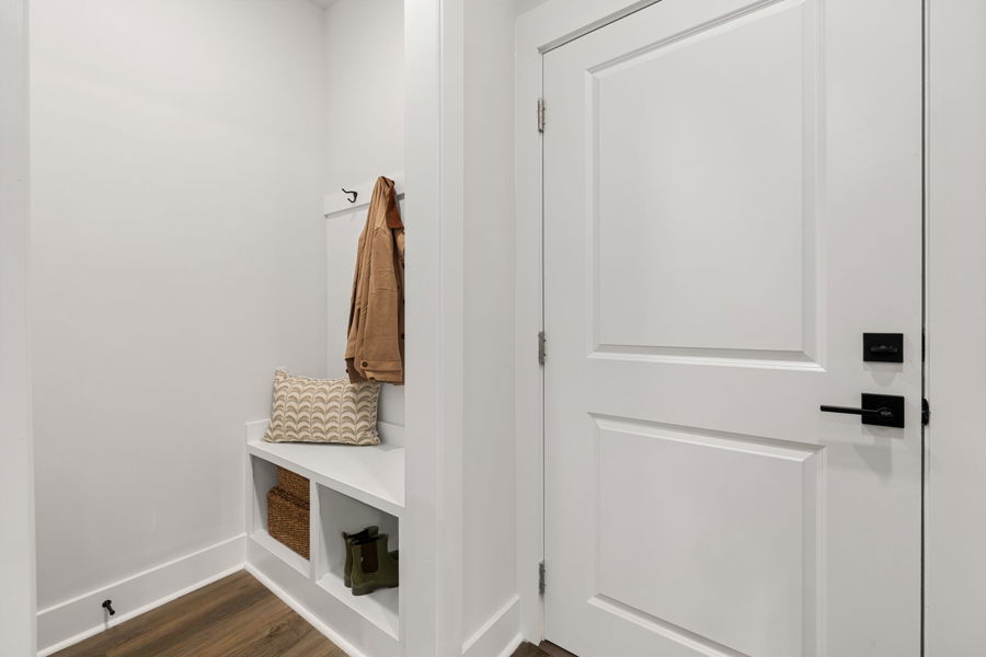 Mud room with built-in bench at HARMON Jefferson Village