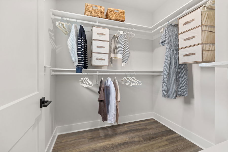 Walk-in closet in the primary suite of a HARMON Jefferson Village townhome