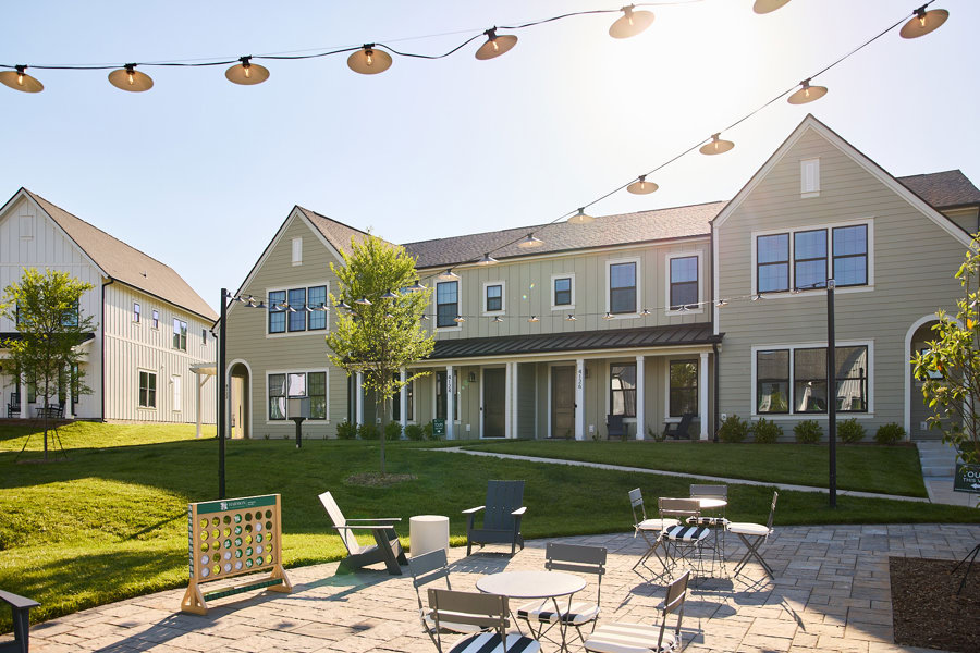 patio with string lights and outdoor games